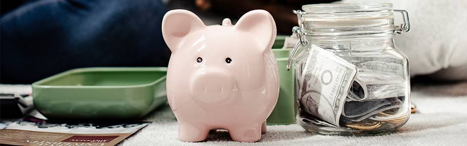 Piggy bank and a jar of money