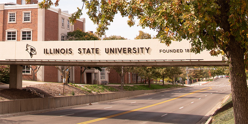 Person standing in front of a whiteboard with English grammar text.