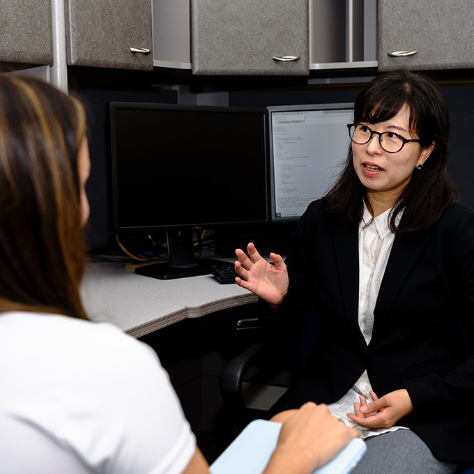 Woman consulting with another person