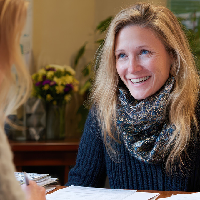 Woman consulting with another person