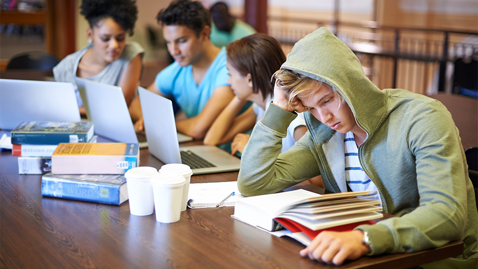 Student looking stressed while studying